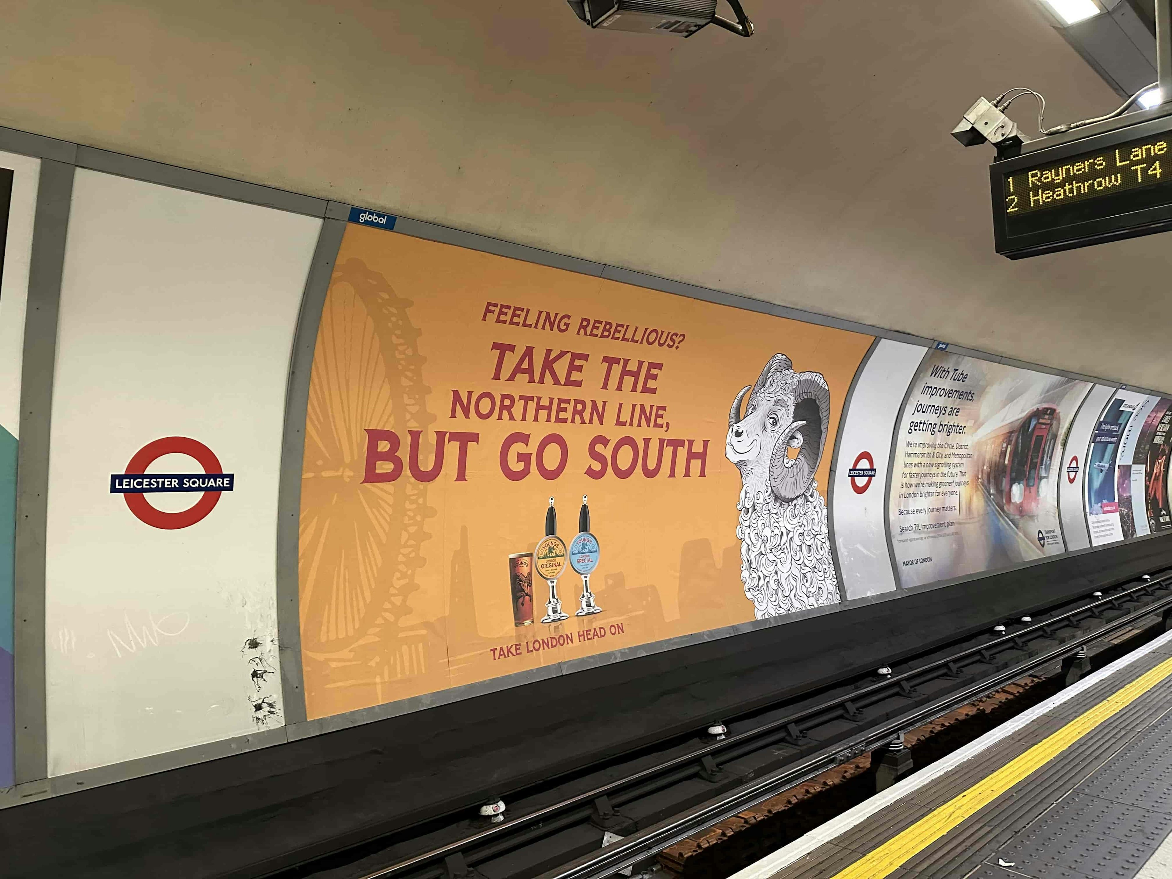 Смешная реклама пива с улыбающимся барашком и надписью 'Take the Nothern line, but go South'